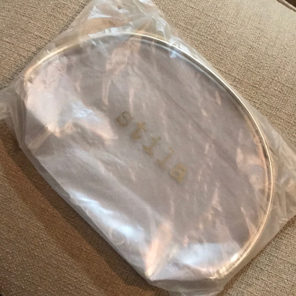 - STILA cosmetic pouch